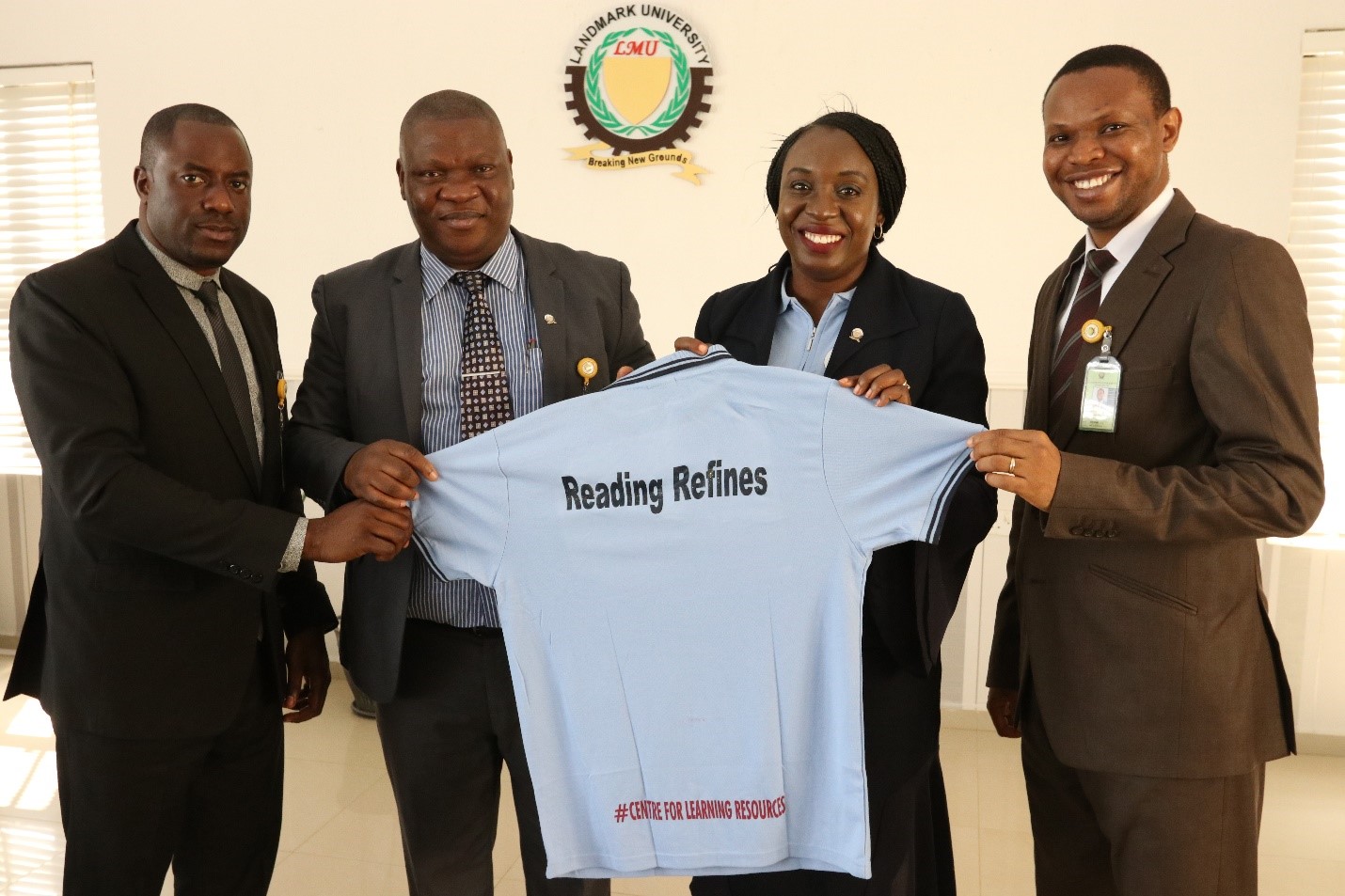 
 The Director, Financial Services, Pastor Fredrick Aghahuwa; the Vice-Chancellor, Professor Adeniyi Olayanju; the Director, Centre for Learning Resources, Mrs. Felicia Yusuf and the Registrar, Dr.Azubuike Ezenwoke displaying the branded t- shirt for the  Library Week.