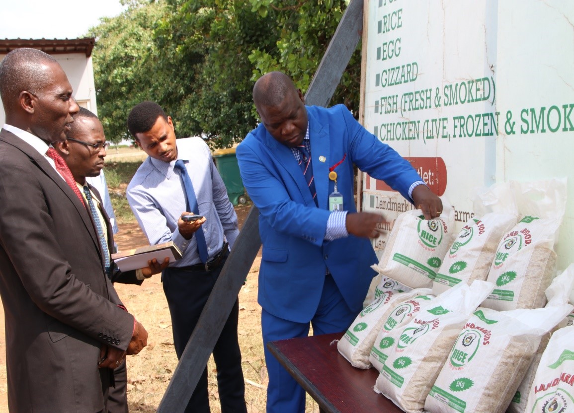 The Vice-Chancellor, Professor Olayanju,  testing the Strength of the Packaging Materials